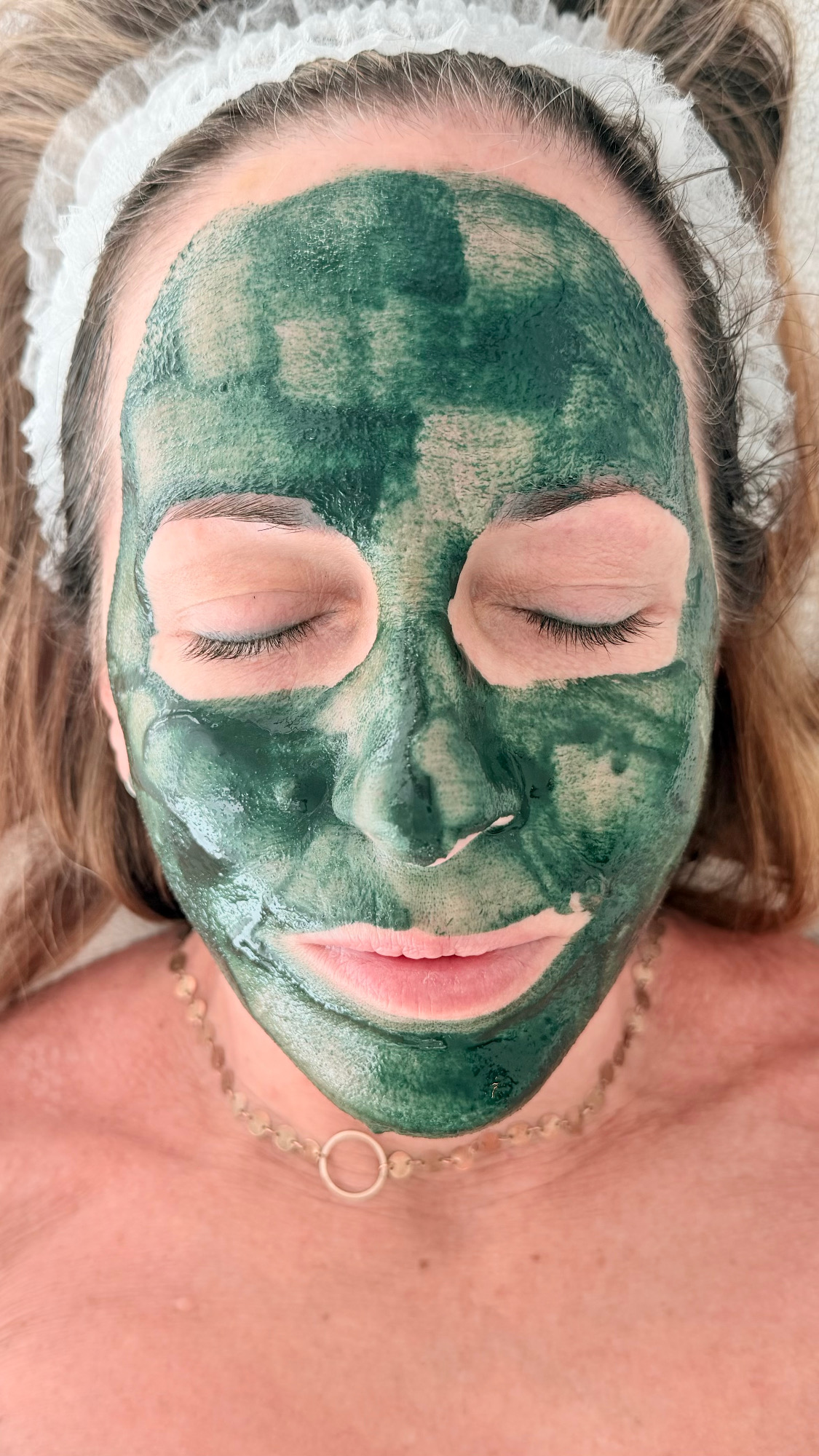 Green Sea Spicule treatment mask applied during facial